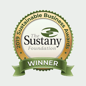 Round badge with "2019 Sustainable Business Awards" and "The Sustany Foundation" in the center, labeled "WINNER" on a green ribbon at the bottom.