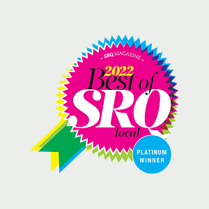 A colorful award badge reads "2022 Best of SRQ local" with a blue circle labeled "Platinum Winner." The badge features jagged edges and overlapping ribbon shapes.